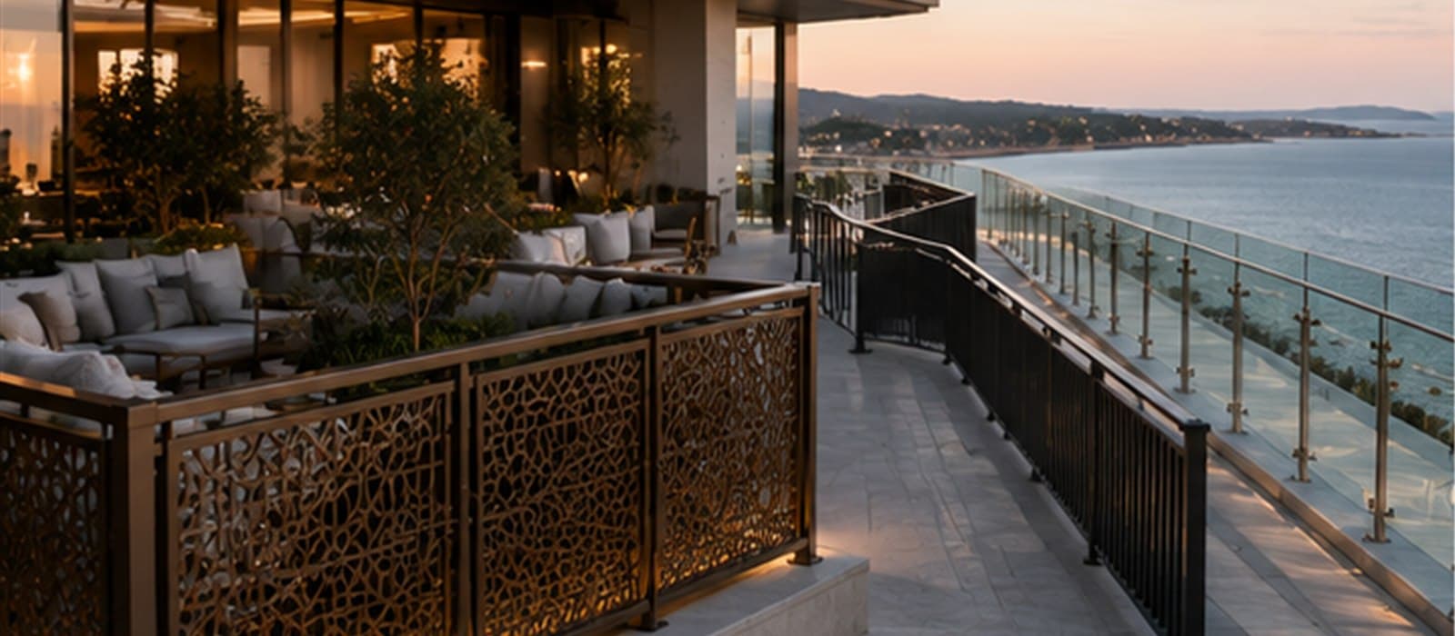 Luxury coastal terrace combining laser-cut metal panels, vertical picket railings and glass balustrades