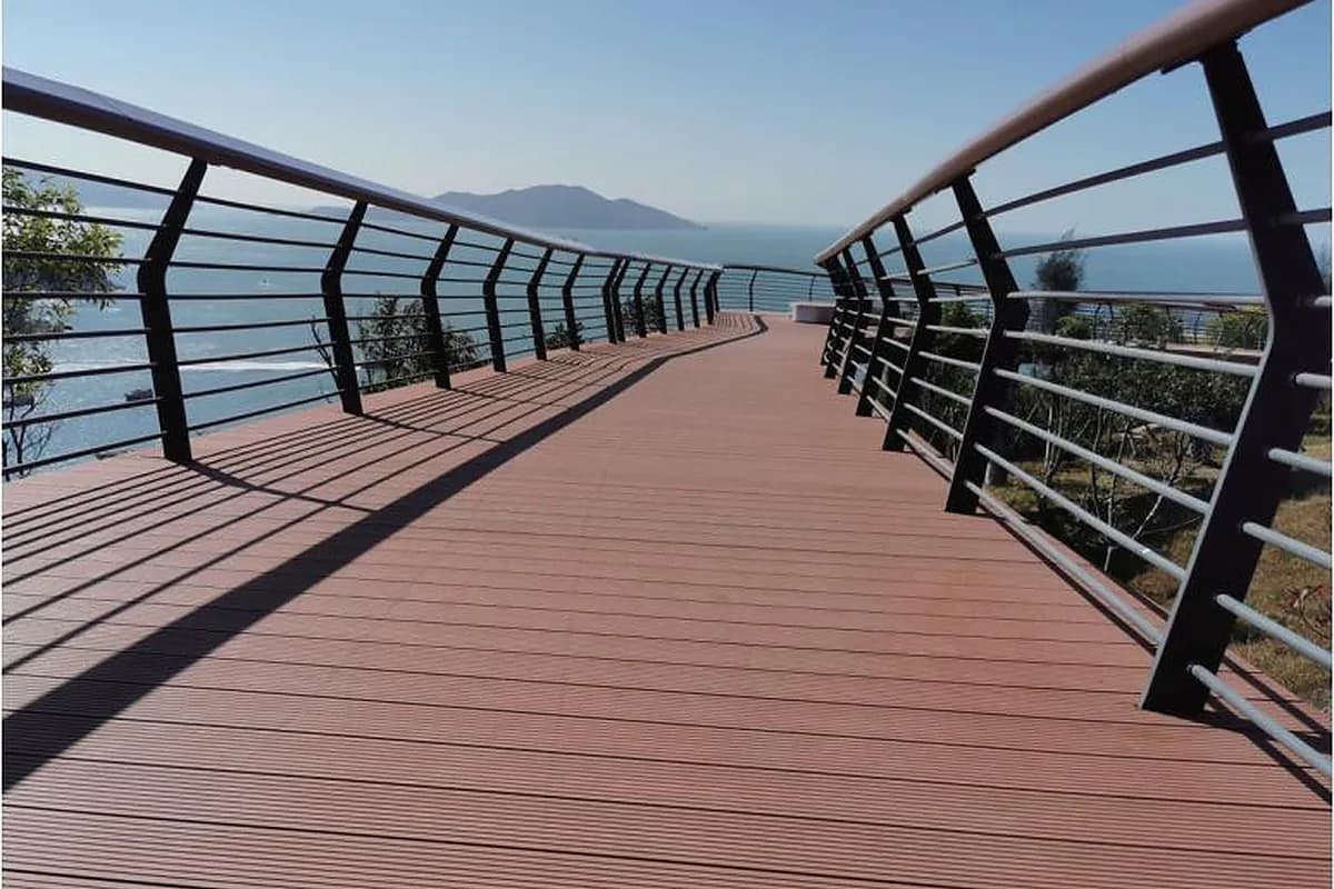 Curved metal landscape guardrail following a coastal walkway on Zhuhai Dong'ao Island